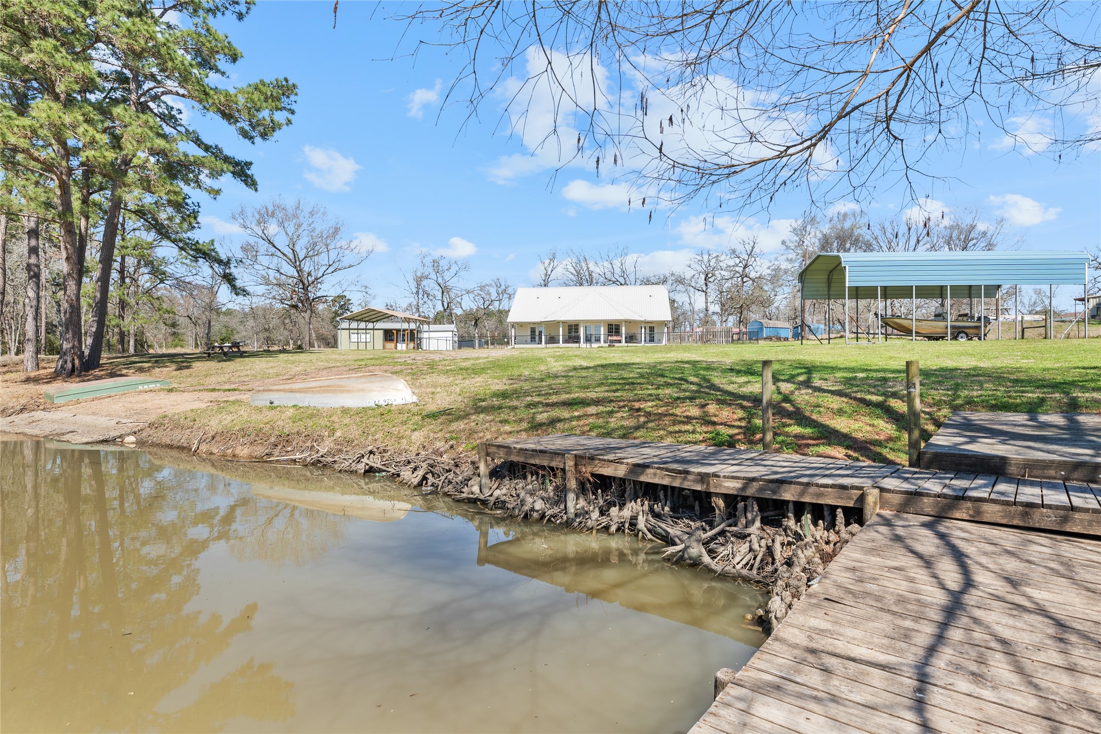 6776 Farm To Market Road 356 Trinity, TX 75862 - Photo 45 of 50 a view of a swimming pool with a patio and a yard