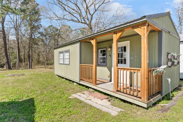 a room with furniture and view kitchen