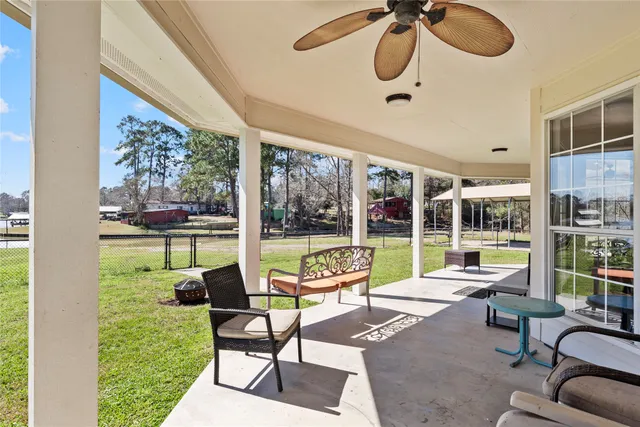 a view of swimming pool with outdoor seating
