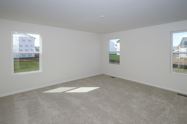 910 Mary, Unit 14 Marengo, IL 60152 - Photo 13 of 27 an empty room with windows