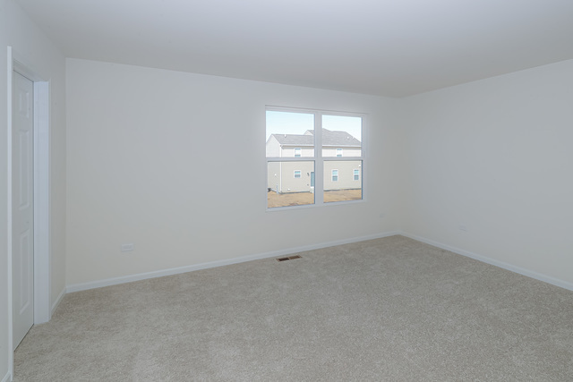 910 Mary, Unit 14 Marengo, IL 60152 - Photo 17 of 27 an empty room with a window