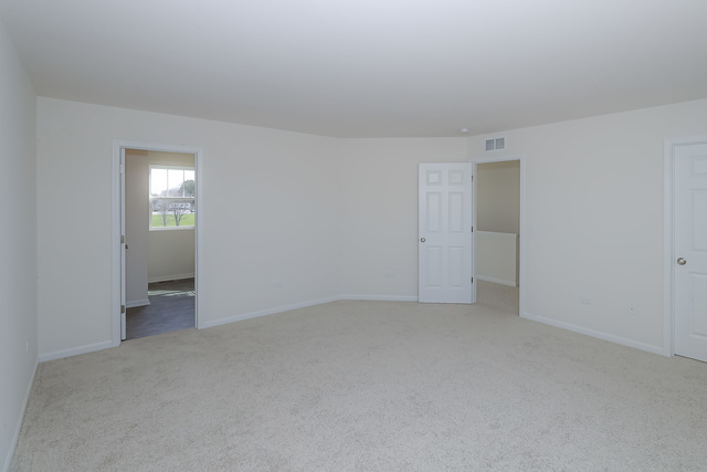 910 Mary, Unit 14 Marengo, IL 60152 - Photo 18 of 27 a view of an empty room and a window