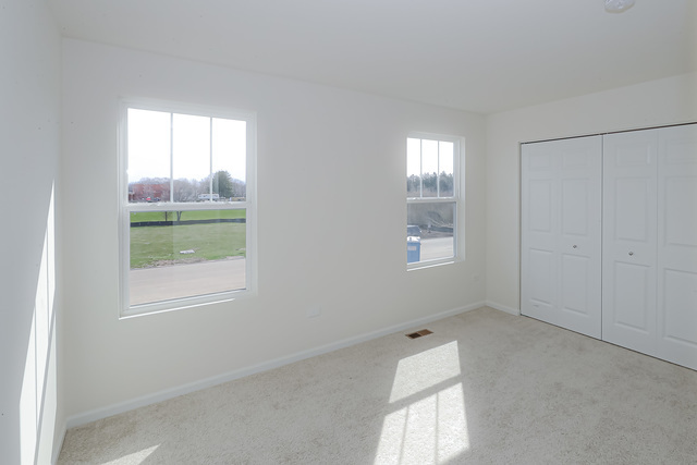 910 Mary, Unit 14 Marengo, IL 60152 - Photo 21 of 27 a view of an empty room and window