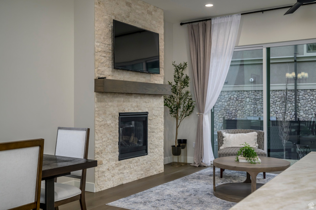 250 South Main Street, Unit 9 Alpine, UT 84004 - Photo 33 of 34 Living area featuring a stone fireplace and dark wood-style floors