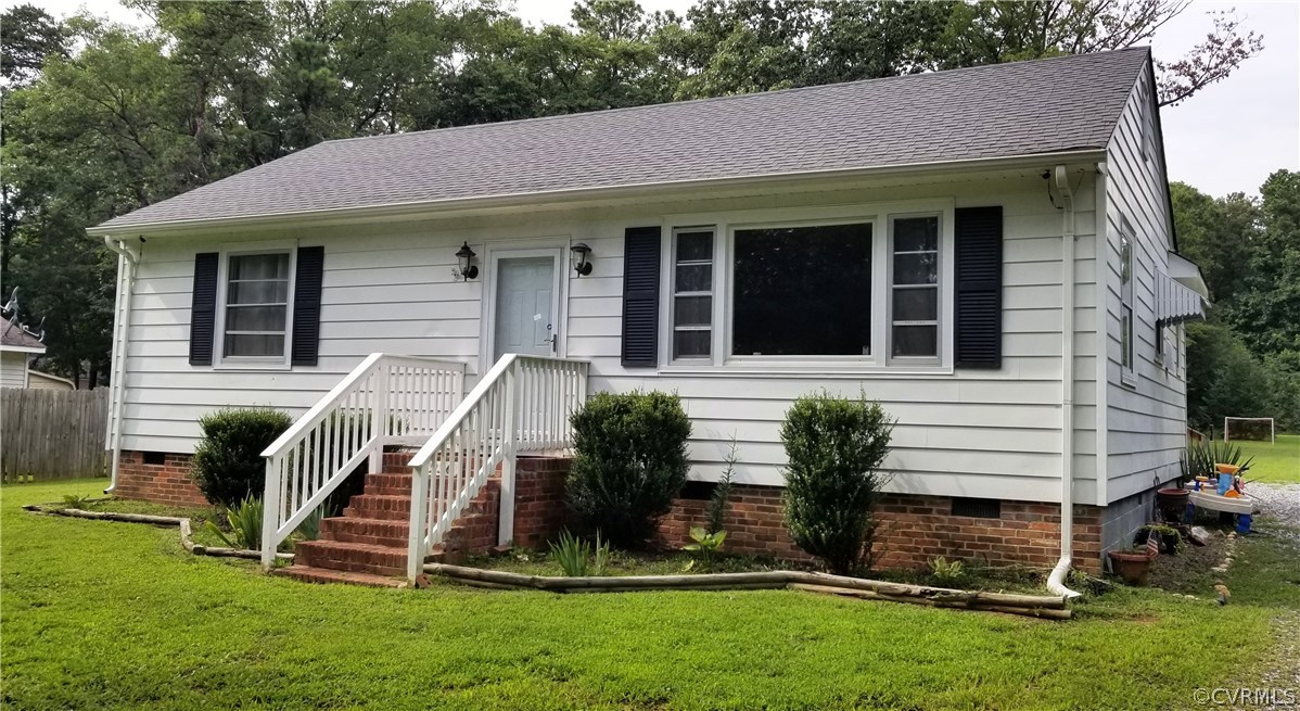 front view of a house with a yard