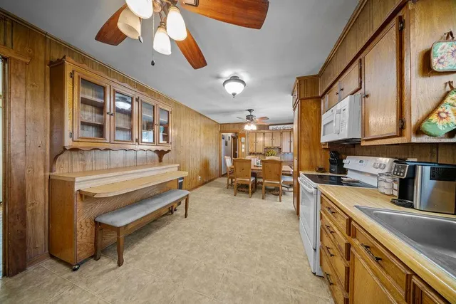 a kitchen with stove and cabinets