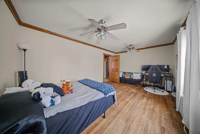 a bed room with furniture and a chandelier