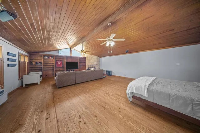 a bedroom with furniture and window