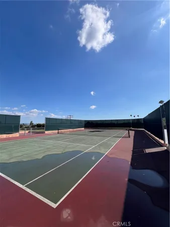 a view of an outdoor space and tennis court