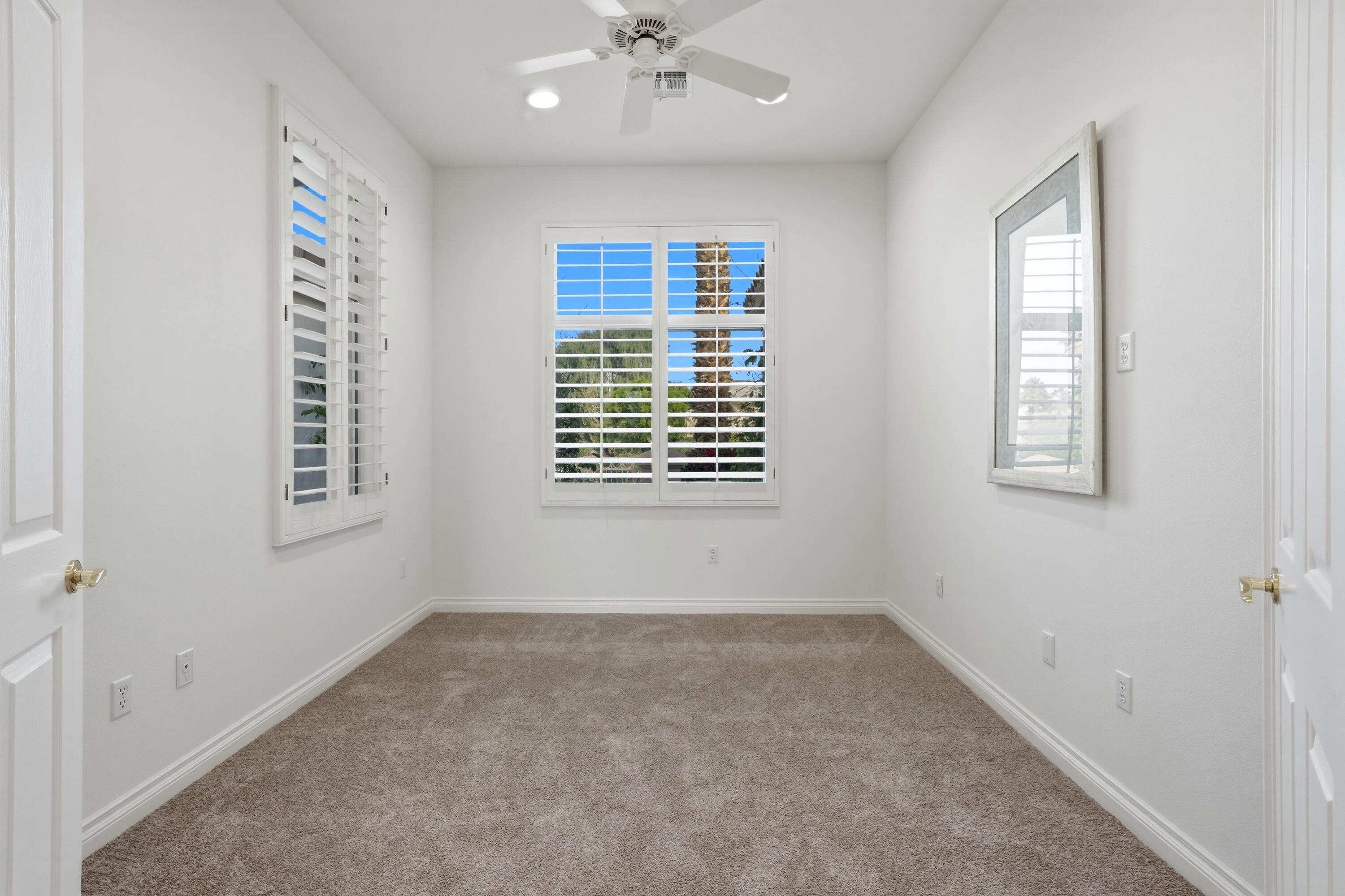 35440 Moorbrook Road Palm Desert, CA 92211 - Photo 14 of 32 a view of an empty room with a window