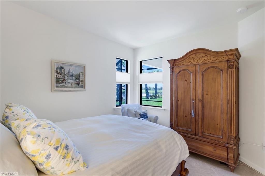5948 Mayflower Way Ave Maria, FL 34142 - Photo 16 of 48 a bedroom with a bed and a window