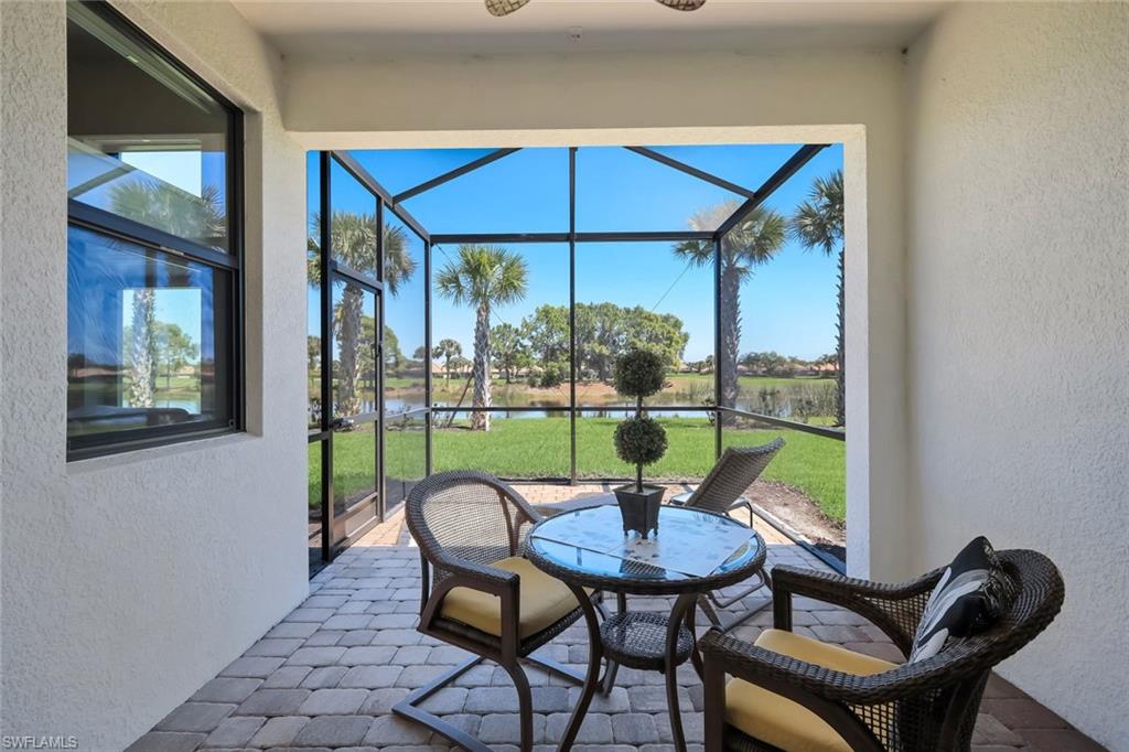 5948 Mayflower Way Ave Maria, FL 34142 - Photo 24 of 48 a view of a room that has a table and chairs in it