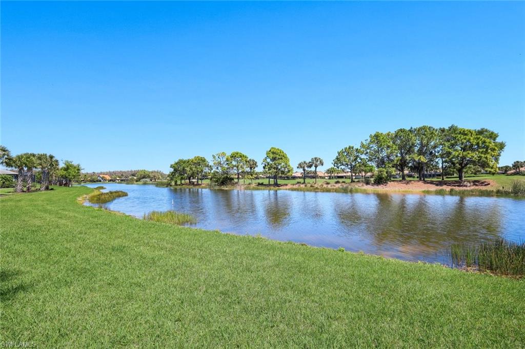 5948 Mayflower Way Ave Maria, FL 34142 - Photo 30 of 48 a view of lake with houses