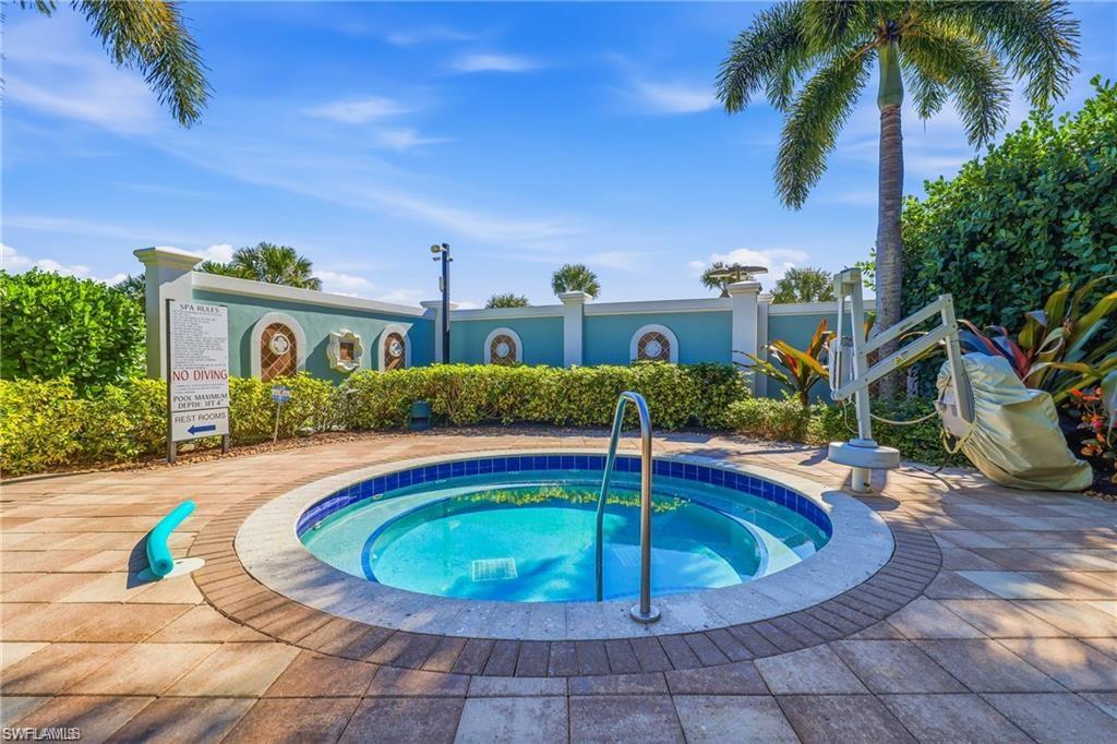 5948 Mayflower Way Ave Maria, FL 34142 - Photo 34 of 48 a view of a swimming pool with a patio
