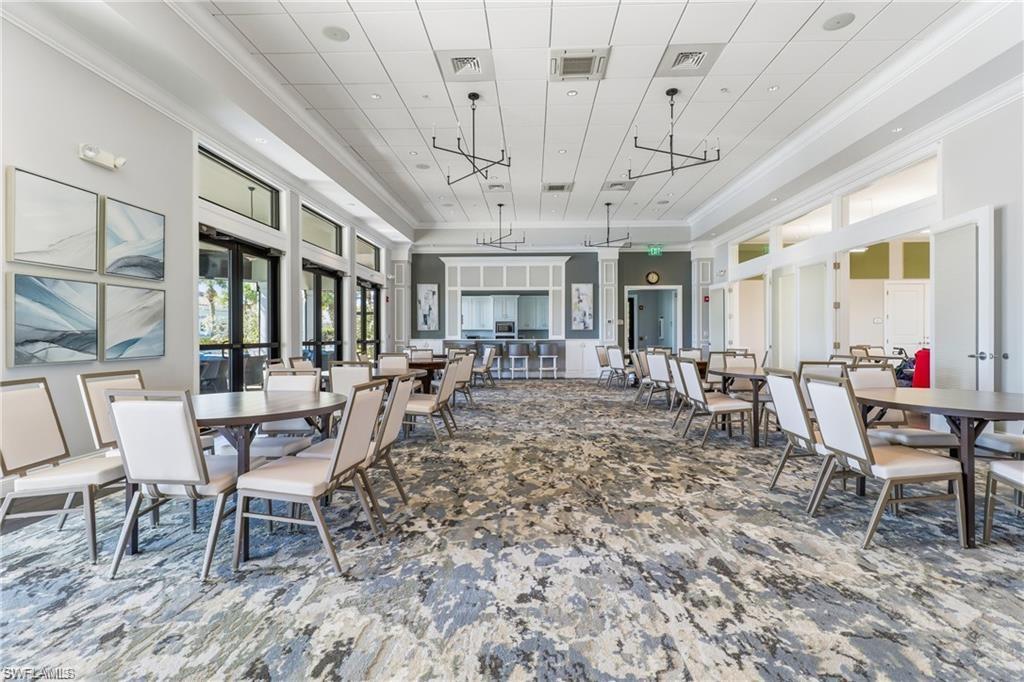 5948 Mayflower Way Ave Maria, FL 34142 - Photo 45 of 48 a view of a dining room with furniture window and outside view
