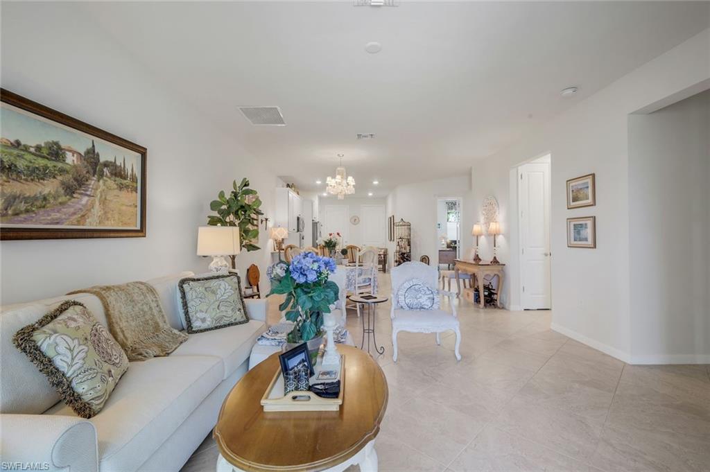 5948 Mayflower Way Ave Maria, FL 34142 - Photo 8 of 48 a living room with furniture and a couch