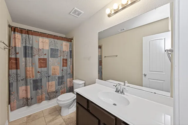 a bedroom with bed and a window