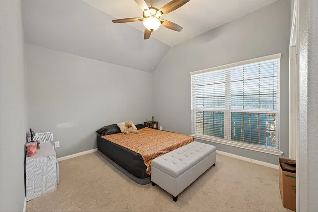 a bathroom with double vanity sinks a vanity a lamp and a mirror