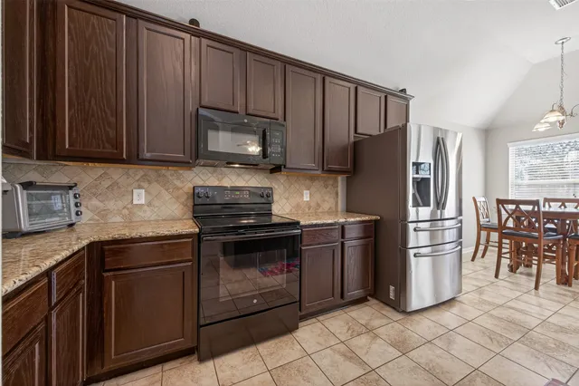 a bed room with a bed and a chandelier
