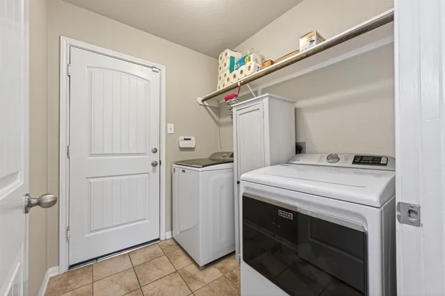 a spacious bathroom with a double vanity sink and a mirror