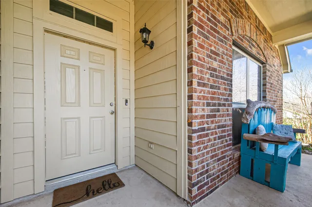 a view of a door and chair in the room