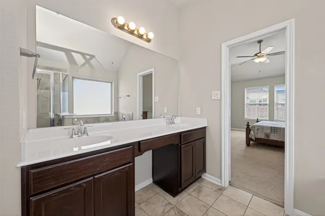 a white bath tub sitting next to a shower