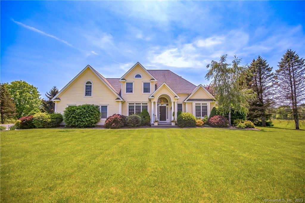 29 Halladay Avenue West Suffield, CT 06078 - Photo 1 of 1 a front view of a house with yard and green space