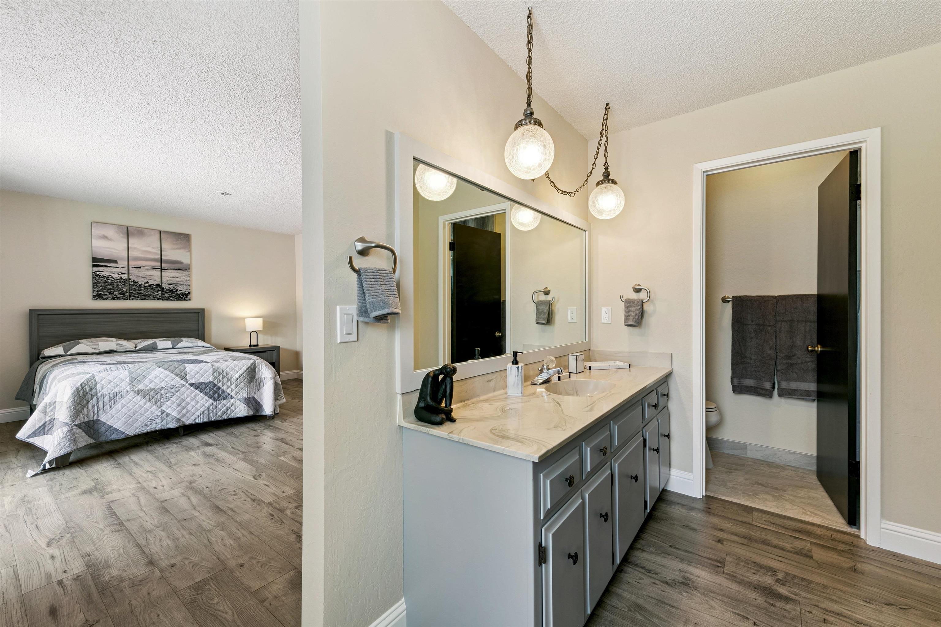 10228 Jeffery Pine Road Truckee, CA 96161 - Photo 21 of 28 a spacious bathroom with a double vanity sink and a mirror