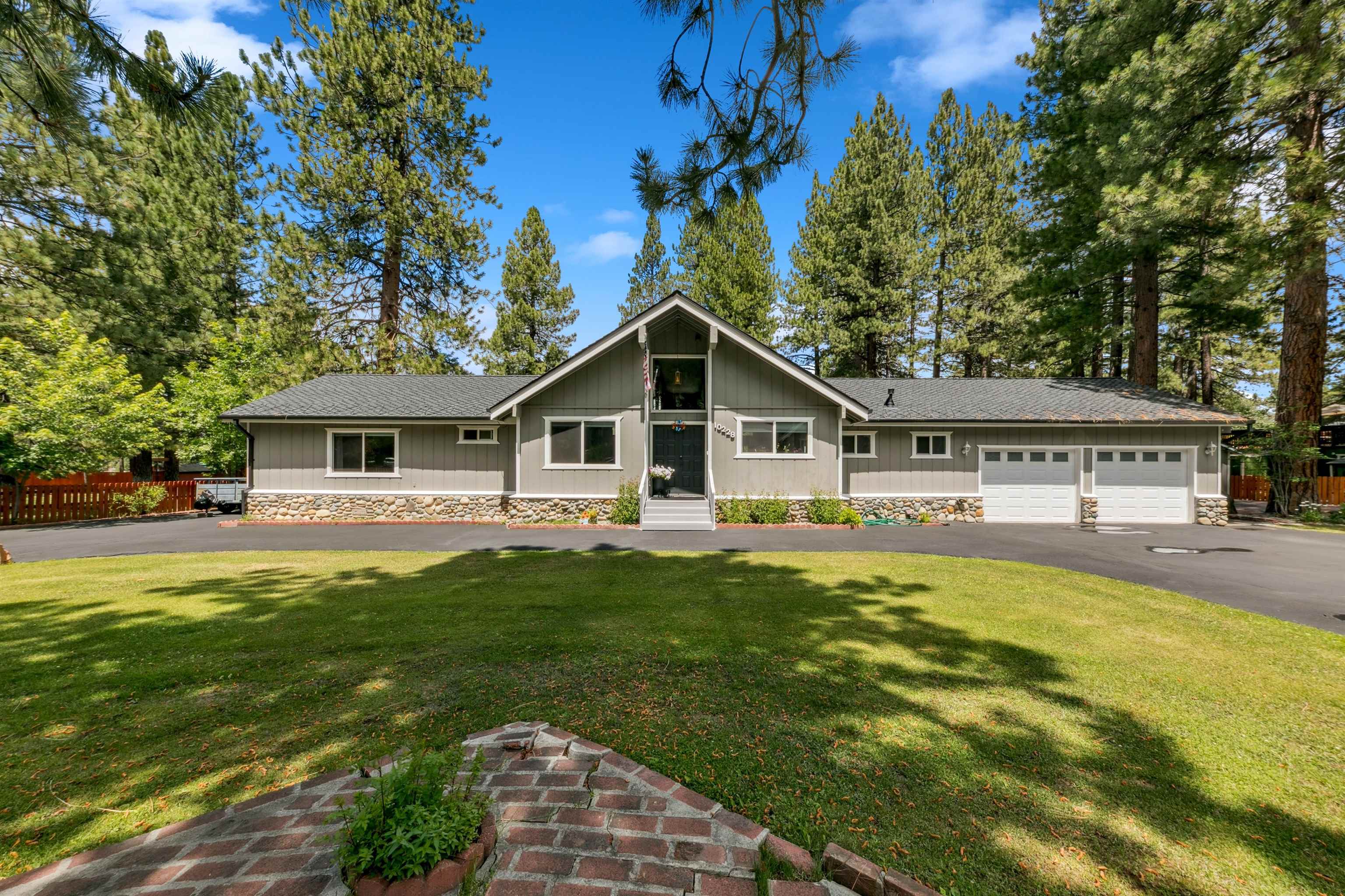 10228 Jeffery Pine Road Truckee, CA 96161 - Photo 3 of 28 a front view of a house with a garden