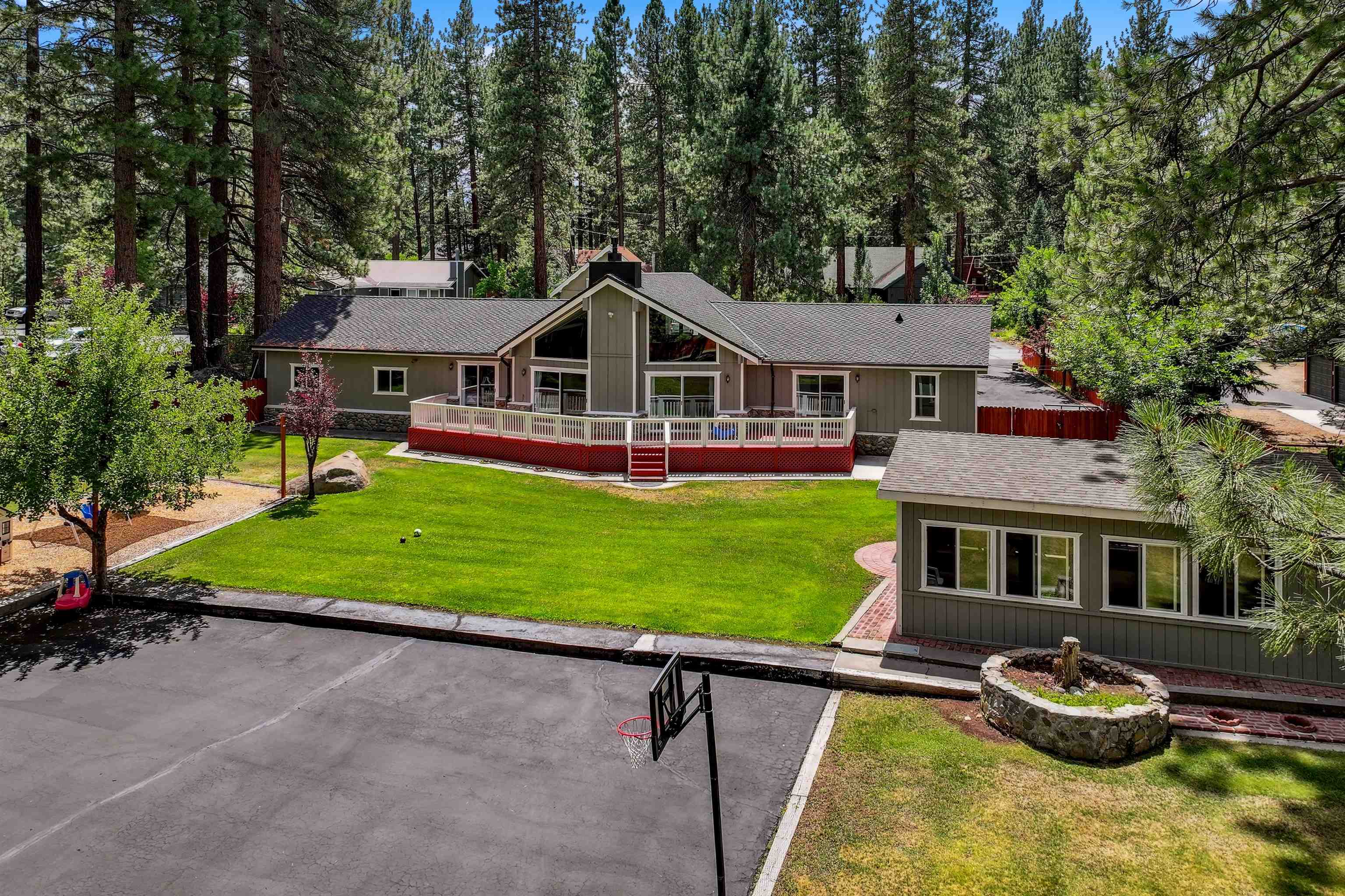 10228 Jeffery Pine Road Truckee, CA 96161 - Photo 5 of 28 a front view of a house with a yard table and chairs