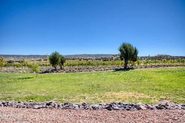 a living room with furniture and wooden floors