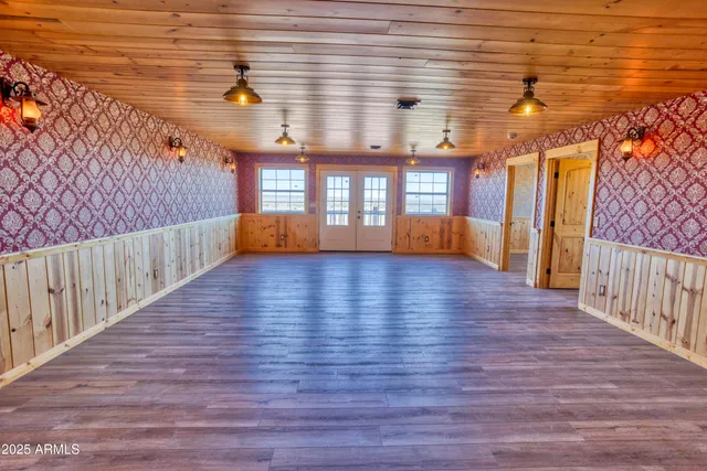 a bathroom with a sink a mirror and a shower curtain