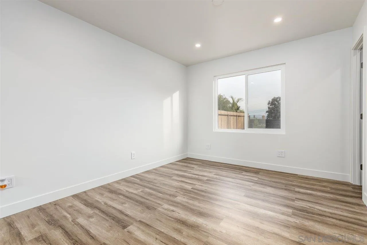 9469 Terrywood Road Santee, CA 92071 - Photo 12 of 25 a view of empty room with wooden floor and fan