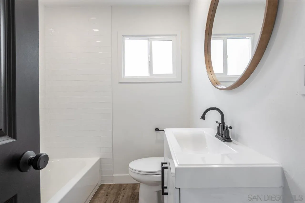 9469 Terrywood Road Santee, CA 92071 - Photo 16 of 25 a bathroom with a sink toilet and a mirror