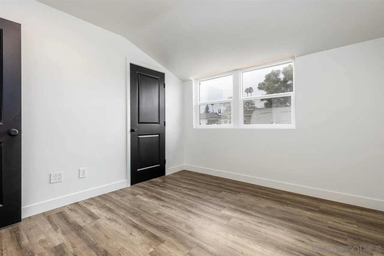 9469 Terrywood Road Santee, CA 92071 - Photo 18 of 25 an empty room with wooden floor and windows