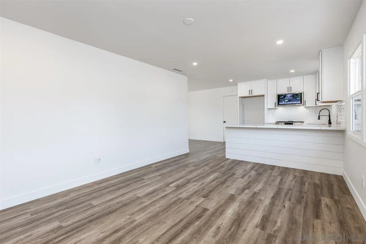 9469 Terrywood Road Santee, CA 92071 - Photo 4 of 25 a view of kitchen with wooden floor and window