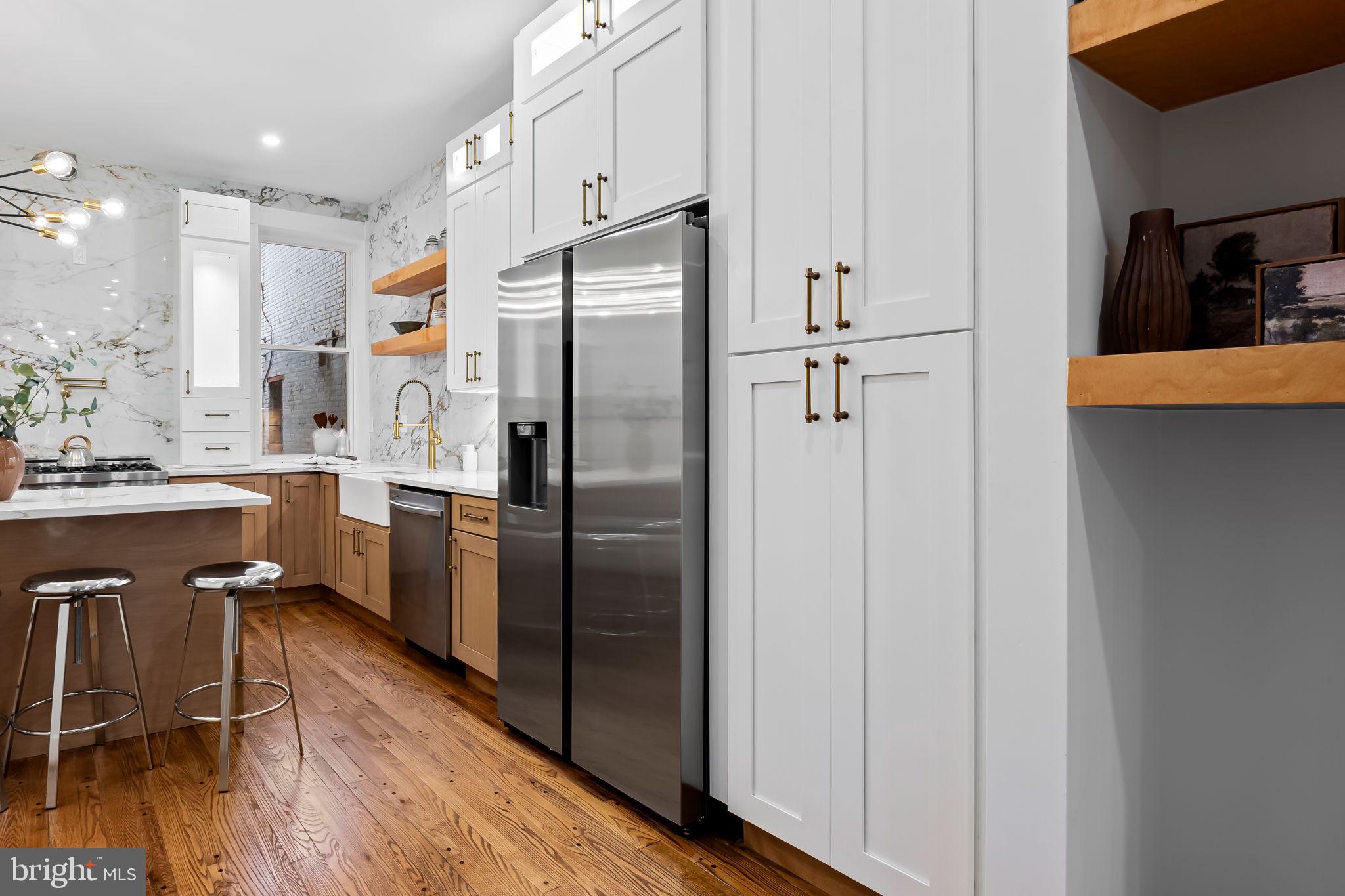 2641 North Calvert Street Baltimore, MD 21218 - Photo 12 of 47 kitchen-island-and-custom-cabinets-renovated-home-