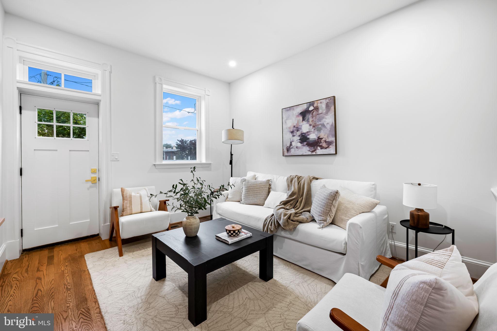 2641 North Calvert Street Baltimore, MD 21218 - Photo 14 of 47 rear-living-room-opens-to-deck-renovated-townhouse