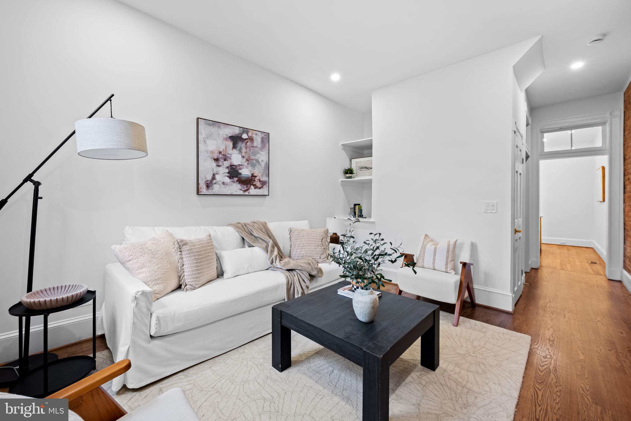 2641 North Calvert Street Baltimore, MD 21218 - Photo 15 of 47 rear-living-room-opens-to-deck-renovated-townhouse