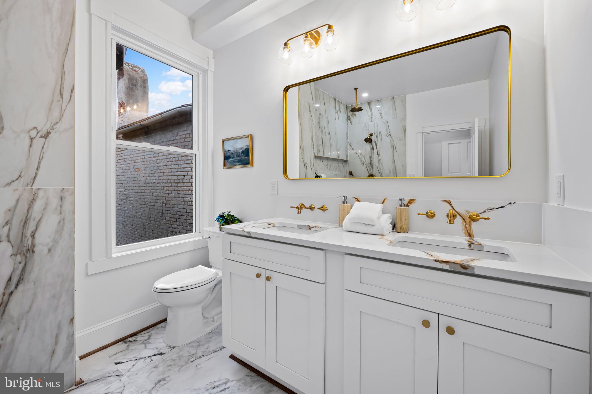 2641 North Calvert Street Baltimore, MD 21218 - Photo 21 of 47 renovated-bathroom-dual-vanities-tile-shower-balti