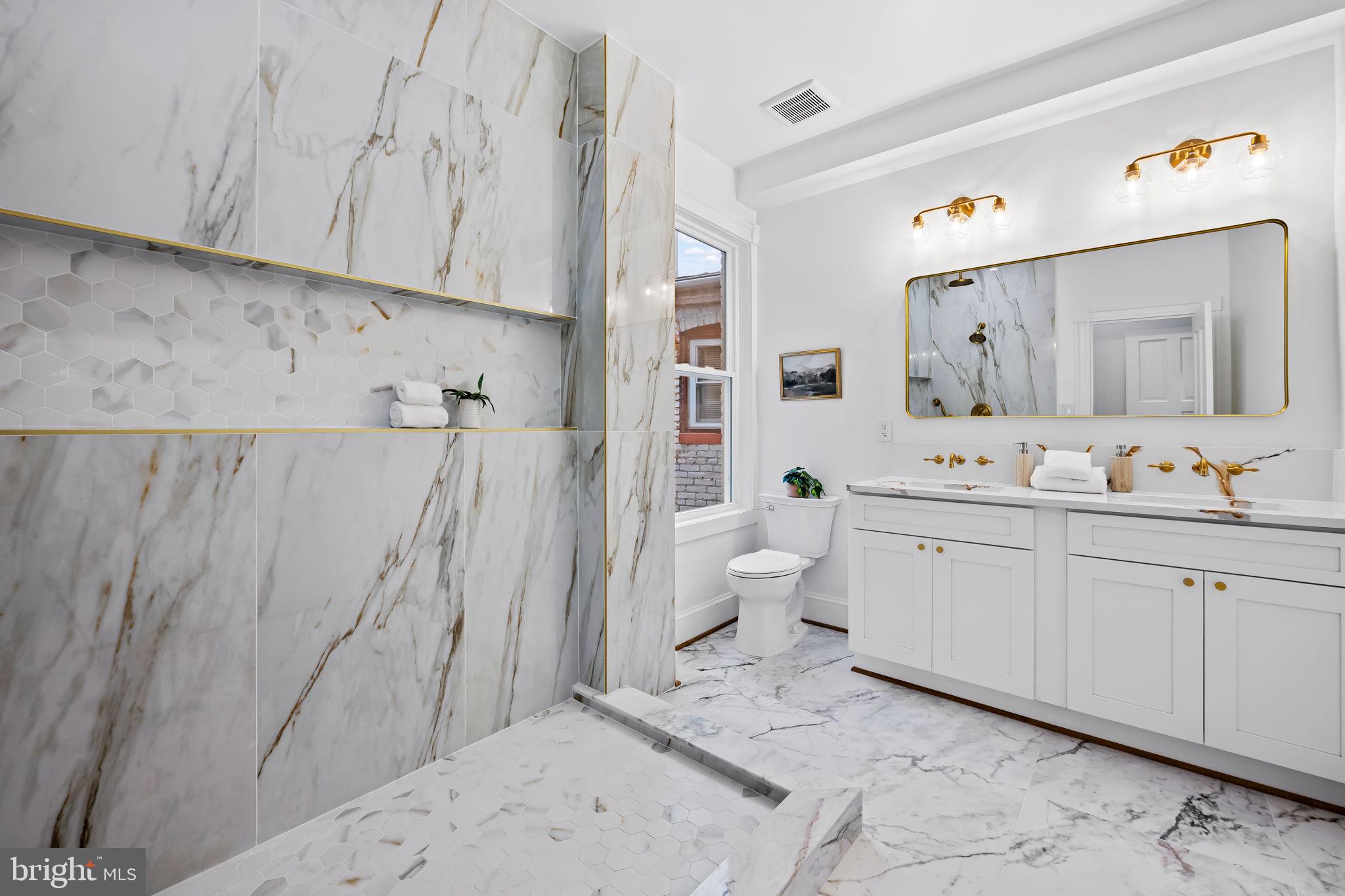 2641 North Calvert Street Baltimore, MD 21218 - Photo 22 of 47 primary-suite-spa-bathroom-walk-in-closet-charles-