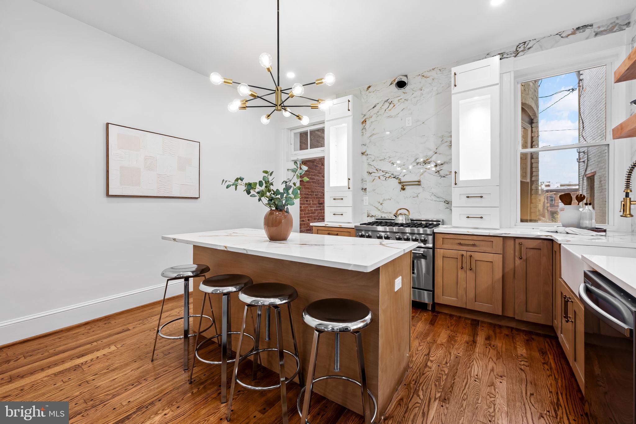 2641 North Calvert Street Baltimore, MD 21218 - Photo 7 of 47 modern-chefs-kitchen-carrera-quartz-gas-range-balt