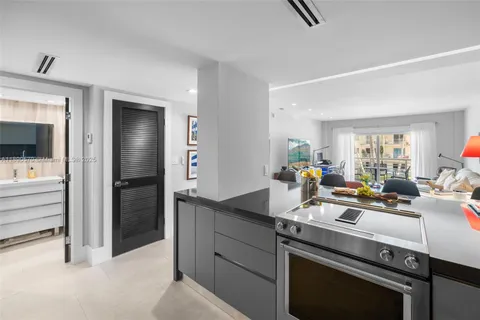 a kitchen with a sink stove and refrigerator