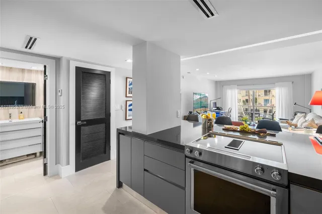 a kitchen with a sink stove and refrigerator