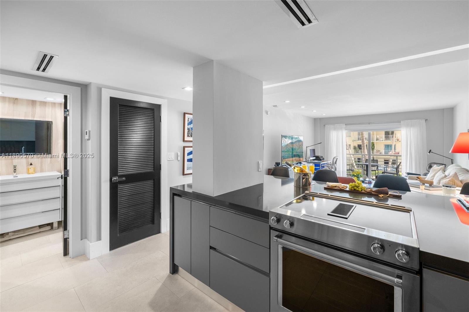 1450 Lincoln Road, Unit 304 Miami Beach, FL 33139 - Photo 11 of 35 a kitchen with a sink stove and refrigerator