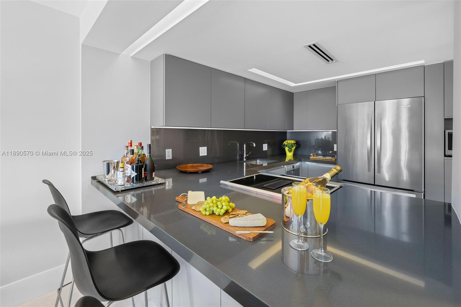 1450 Lincoln Road, Unit 304 Miami Beach, FL 33139 - Photo 12 of 35 a living room with furniture and kitchen view