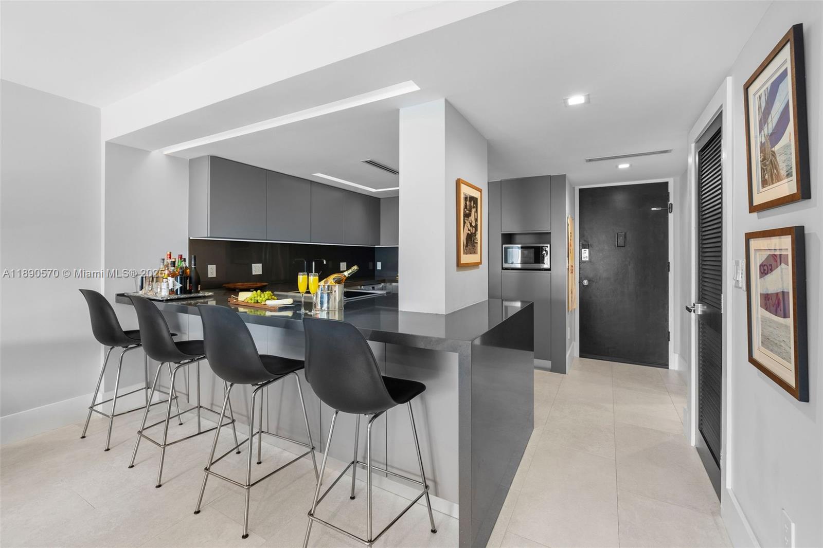 1450 Lincoln Road, Unit 304 Miami Beach, FL 33139 - Photo 13 of 35 a dining room with furniture and chandelier