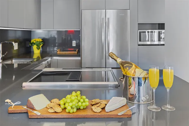a kitchen with a sink and a refrigerator