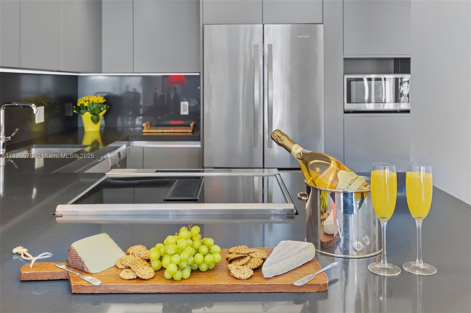 1450 Lincoln Road, Unit 304 Miami Beach, FL 33139 - Photo 14 of 35 a kitchen with a sink and a refrigerator