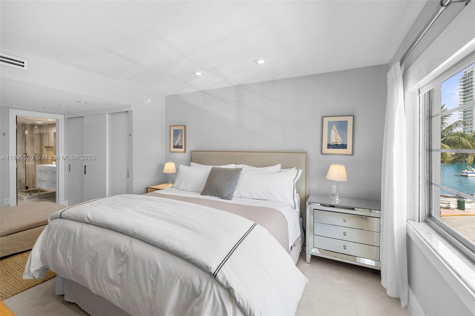 1450 Lincoln Road, Unit 304 Miami Beach, FL 33139 - Photo 19 of 35 a bedroom with a bed and a cabinets